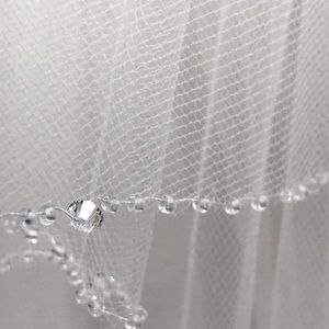 White hand stitched 40 inch veil.